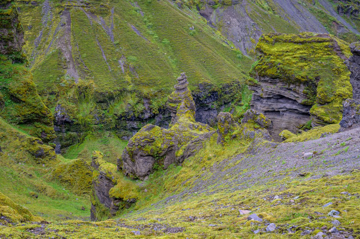 Mossy cliffs fold into the hidden depths of Múlagljúfur Canyon.